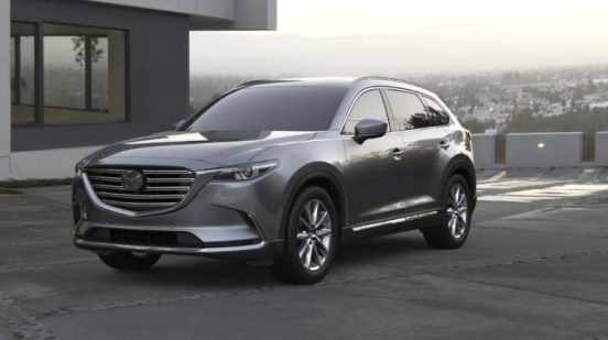 Image of a silver 2019 Mazda CX-9 parked in a driveway.