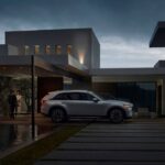 A Mazda PHEV charging in a driveway
