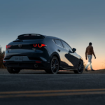 Mazda warranty vehicle parked against a sunset