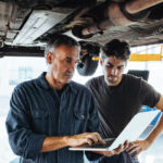 Customer and service technician looking at a laptop