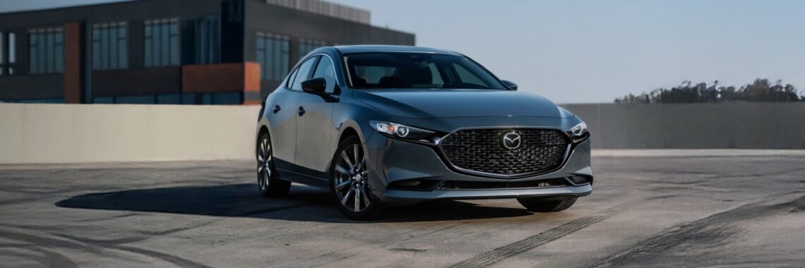 2026 Mazda3 Sedan on top of a parking garage.