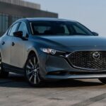 2026 Mazda3 Sedan on top of a parking garage.