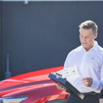 Mazda service customer speaking with a service tech